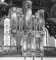 A picture of an organ in a church.