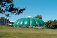 A large dome tent to cover manure on Macdonald farm.