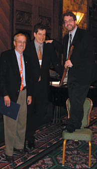 Novelist and vertically challenged humorist Will Ferguson took advantage of some furniture at the Four Seasons Hotel to stand tall at the Vancouver Leacock Luncheon held in October. Ferguson was the guest lecturer and is pictured with Vancouver branch president Todd Law, BEng'87 (centre), and Luncheon emcee Derek Drummond, BArch'62, Macdonald Professor of Architecture at McGill.