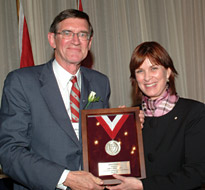 Jim Wright receives the Alumni Association's highest honour, the Award of Merit, from Principal Heather Munroe-Blum, who was herself presented with a special Honorary Life Membership.