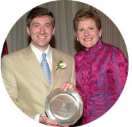 Regional Director of the Alumni Association in Boston Ian Pilarczyk, BA'92, LLM'97, DCL'03, receives his E.P. Taylor Award for outstanding voluntary service from Nancy Wells, Vice-Principal of Development and Alumni Relations.