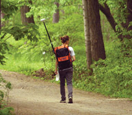 A student uses a Global Positioning System in the Morgan Arboretum.