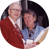 Russ Merifield, BA’38, BCL’40, is presented with the Outstanding Alumnus Award by Andrea Alexander, BPE’60, honorary president of the Toronto branch and last year’s recipient of the award.