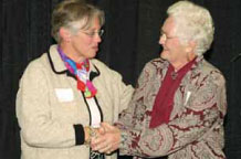Anne Turnbull is congratulated by McGill Governor.