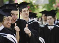 Grads in cap and gown.