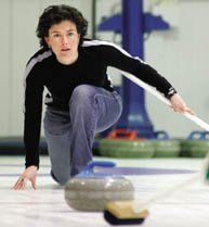 McGill Young Alumni president Catherine Cunningham, BA'99, CertHRMgmt'00, keeps careful watch as her stone glides down the ice.