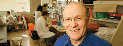 Nahum Sonenberg smiles in his lab.